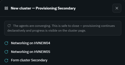 Ballast console cluster provisioning dialog: Networking on HVNEW04, Networking on HVNEW05, and Form cluster Secondary steps in progress, with a note that this is safe to close and continues in the background